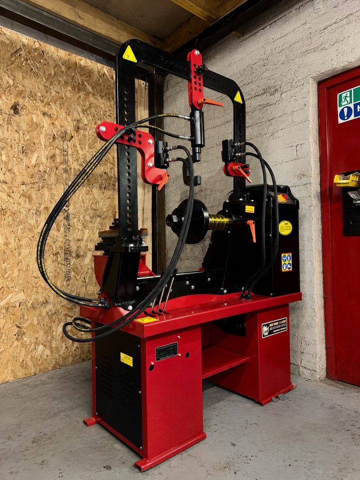 Professional wheel straightening machine in the Baig Tyres workshop